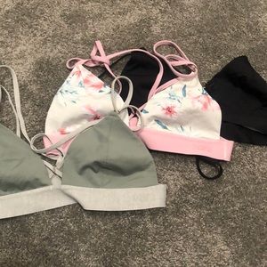 3 pink bralettes